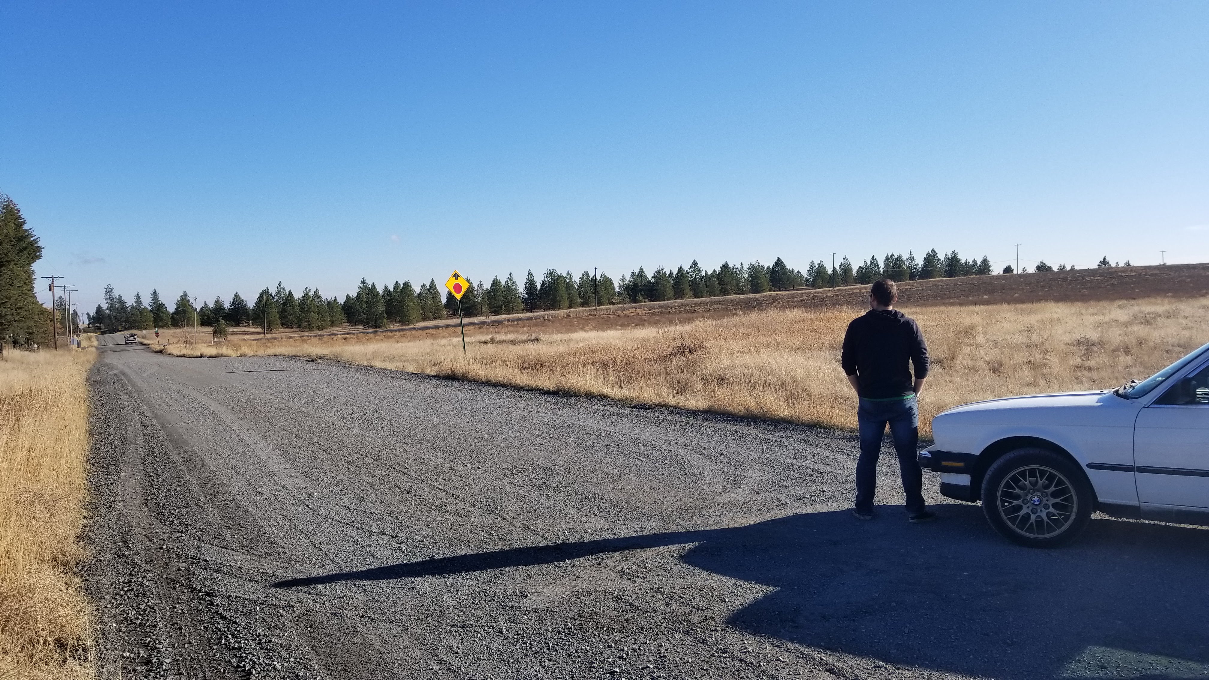 Colby Standing in front of the e30